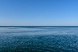 Calm ocean with blue sky